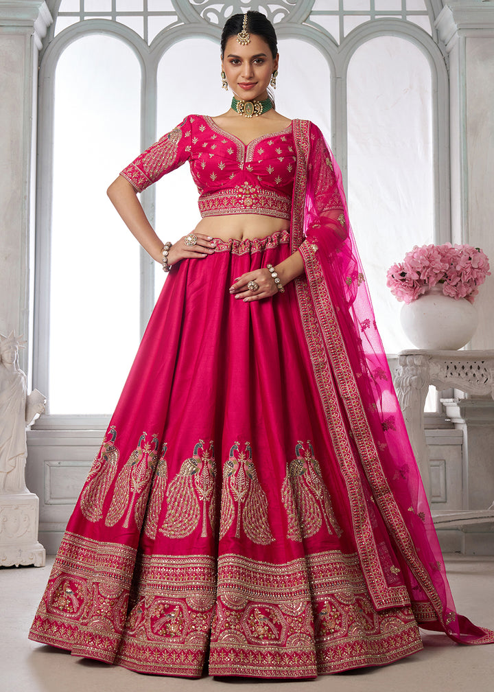 Buy Now Designer Pink Silk Lehenga Choli with Embroidered Peacock Motifs Online in US, UK, Canada, France, Italy, Greece, Sweden, UAE &amp; Worldwide at Empress.
