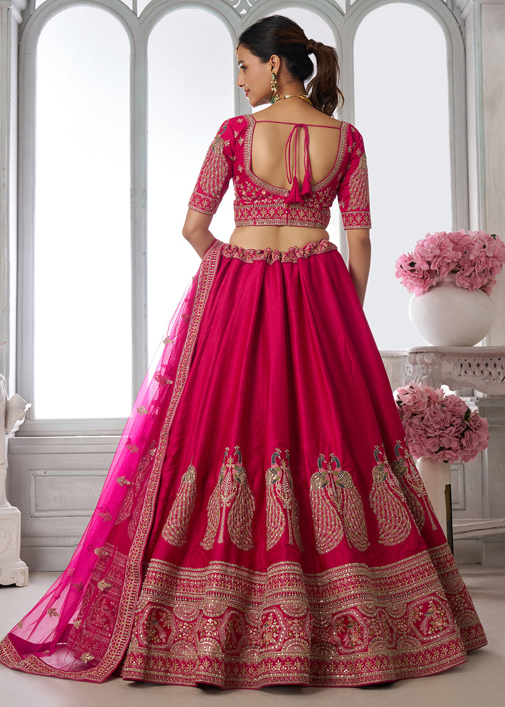 Buy Now Designer Pink Silk Lehenga Choli with Embroidered Peacock Motifs Online in US, UK, Canada, France, Italy, Greece, Sweden, UAE &amp; Worldwide at Empress.