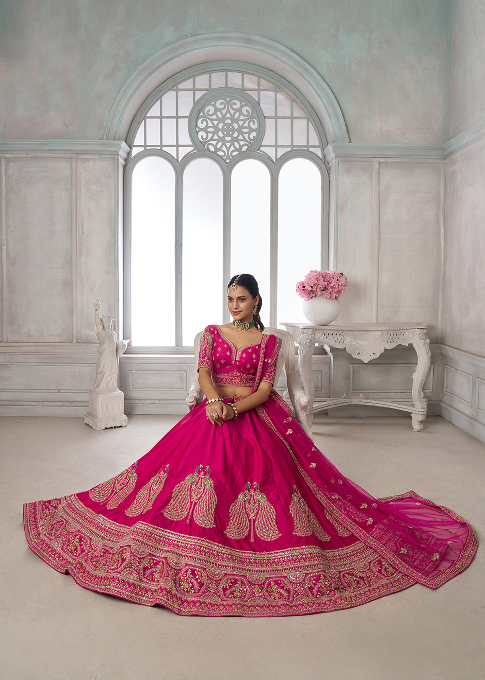 Buy Now Designer Pink Silk Lehenga Choli with Embroidered Peacock Motifs Online in US, UK, Canada, France, Italy, Greece, Sweden, UAE &amp; Worldwide at Empress.