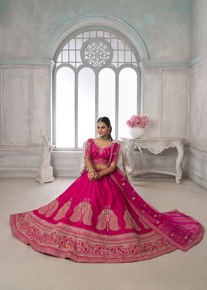 Buy Now Designer Pink Silk Lehenga Choli with Embroidered Peacock Motifs Online in US, UK, Canada, France, Italy, Greece, Sweden, UAE &amp; Worldwide at Empress.