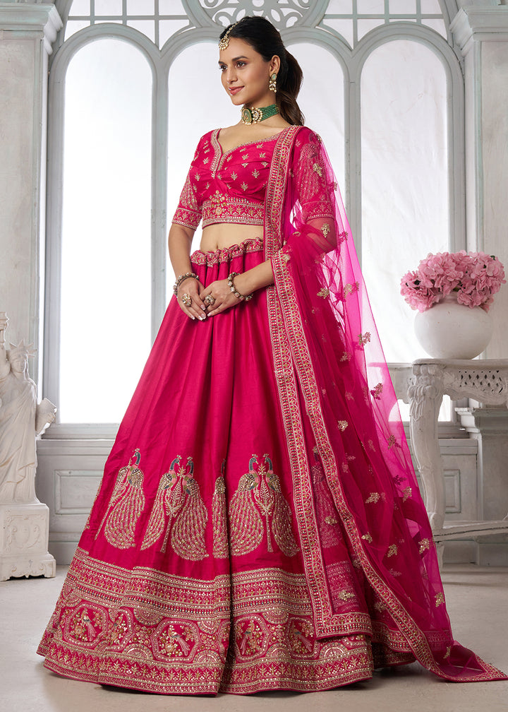 Buy Now Designer Pink Silk Lehenga Choli with Embroidered Peacock Motifs Online in US, UK, Canada, France, Italy, Greece, Sweden, UAE &amp; Worldwide at Empress.