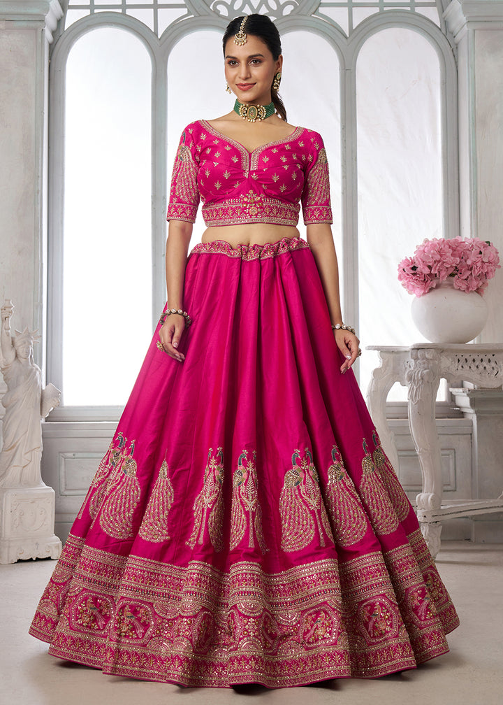 Buy Now Designer Pink Silk Lehenga Choli with Embroidered Peacock Motifs Online in US, UK, Canada, France, Italy, Greece, Sweden, UAE &amp; Worldwide at Empress.
