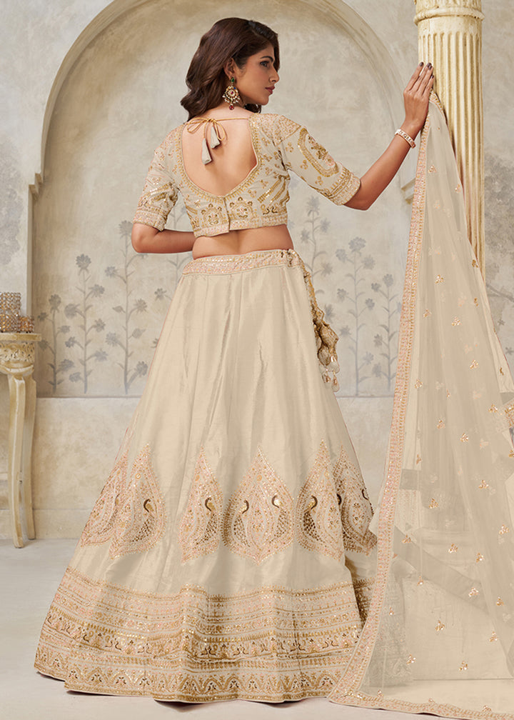 Buy Now Cream Leaf Motifs Embroidered Wedding Lehenga Choli Online in US, UK, Canada, France, Italy, Germany, Sweden, Denmark, Greece & Worldwide at Empress.