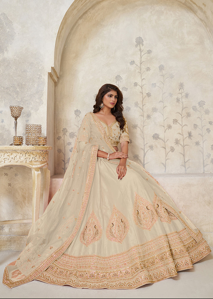Buy Now Cream Leaf Motifs Embroidered Wedding Lehenga Choli Online in US, UK, Canada, France, Italy, Germany, Sweden, Denmark, Greece & Worldwide at Empress.