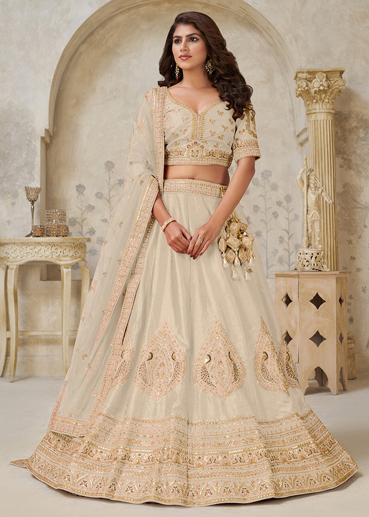 Buy Now Cream Leaf Motifs Embroidered Wedding Lehenga Choli Online in US, UK, Canada, France, Italy, Germany, Sweden, Denmark, Greece & Worldwide at Empress.