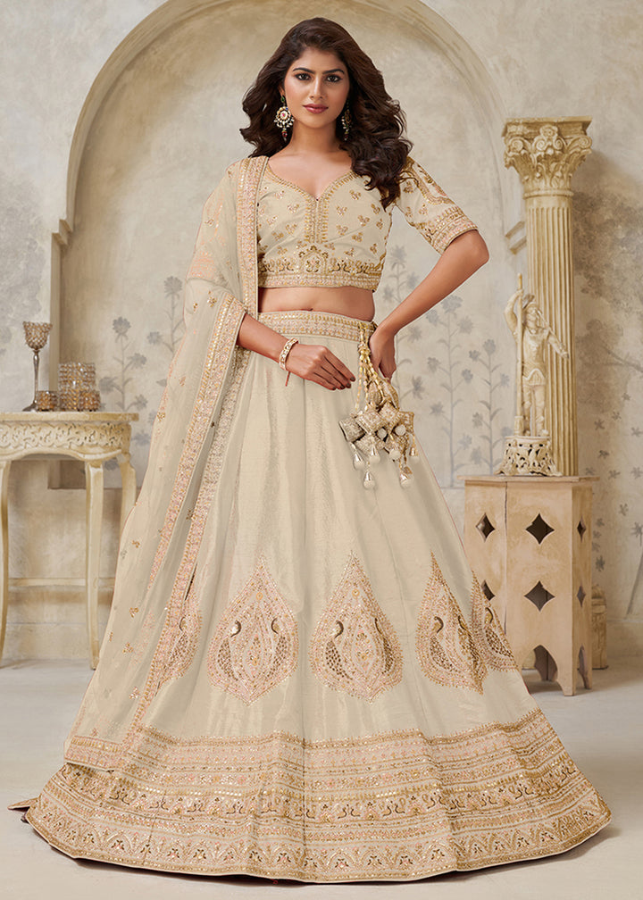 Buy Now Cream Leaf Motifs Embroidered Wedding Lehenga Choli Online in US, UK, Canada, France, Italy, Germany, Sweden, Denmark, Greece & Worldwide at Empress.
