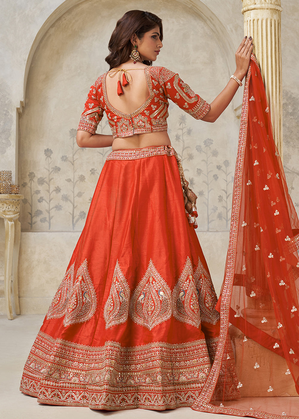 Buy Now Orange Leaf Motifs Embroidered Wedding Lehenga Choli Online in US, UK, Canada, France, Italy, Germany, Sweden, Denmark, Greece & Worldwide at Empress.