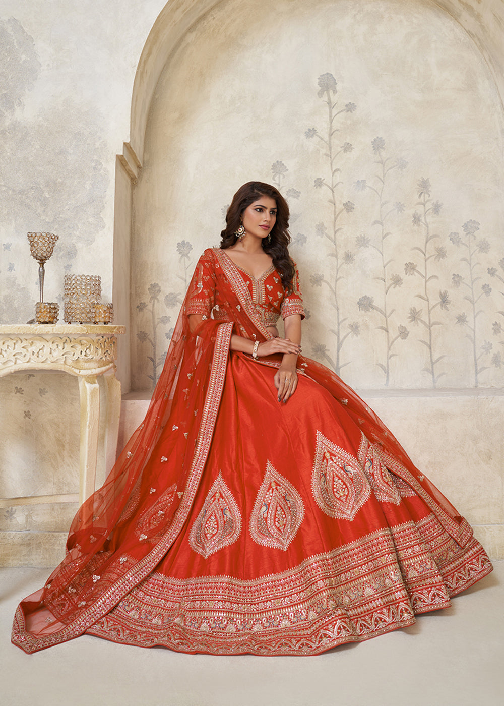 Buy Now Orange Leaf Motifs Embroidered Wedding Lehenga Choli Online in US, UK, Canada, France, Italy, Germany, Sweden, Denmark, Greece & Worldwide at Empress.