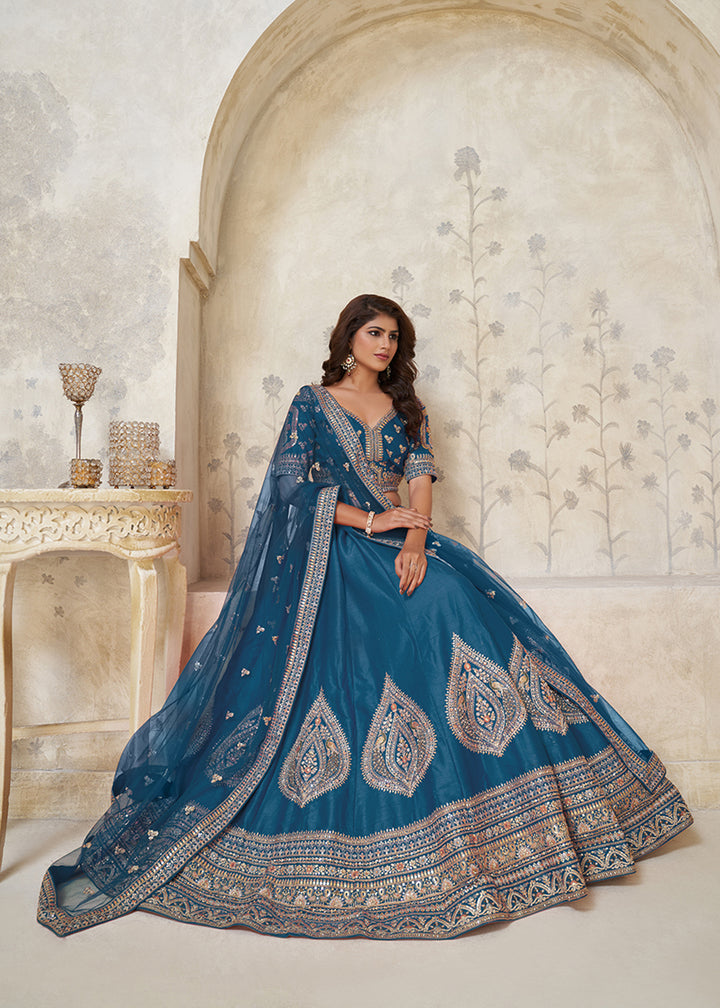 Buy Now Blue Leaf Motifs Embroidered Wedding Lehenga Choli Online in US, UK, Canada, France, Italy, Germany, Sweden, Denmark, Greece & Worldwide at Empress.