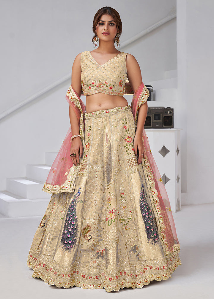 Buy Now Cream Peacock Feather Motifs Traditional Lehenga Choli Online in US, UK, Canada, France, Italy, Germany, Sweden, Denmark, Greece & Worldwide at Empress.