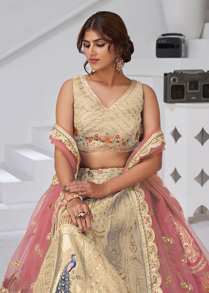 Buy Now Cream Peacock Feather Motifs Traditional Lehenga Choli Online in US, UK, Canada, France, Italy, Germany, Sweden, Denmark, Greece & Worldwide at Empress.