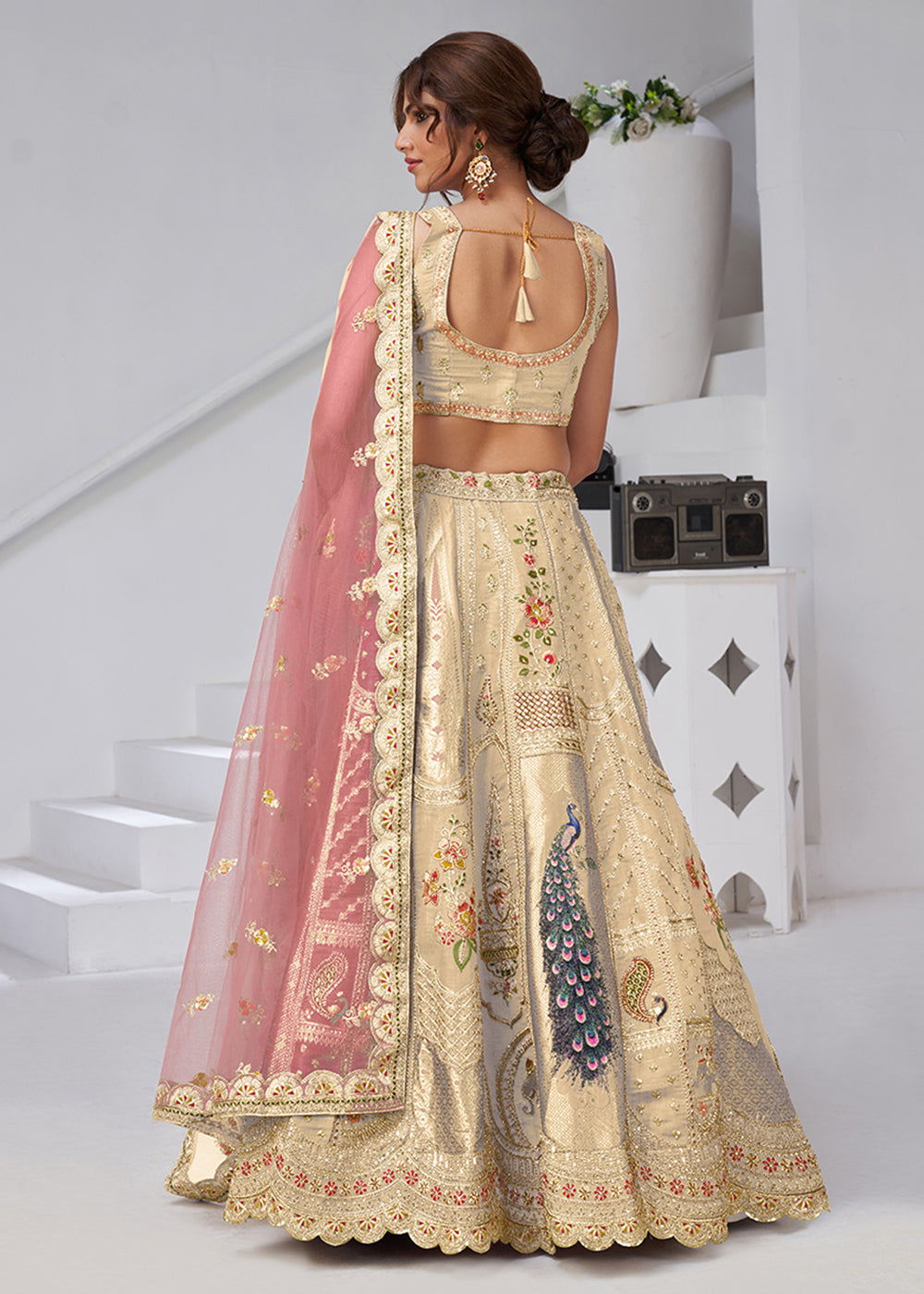 Buy Now Cream Peacock Feather Motifs Traditional Lehenga Choli Online in US, UK, Canada, France, Italy, Germany, Sweden, Denmark, Greece & Worldwide at Empress.