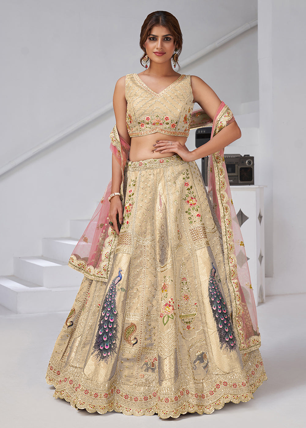Buy Now Cream Peacock Feather Motifs Traditional Lehenga Choli Online in US, UK, Canada, France, Italy, Germany, Sweden, Denmark, Greece & Worldwide at Empress.