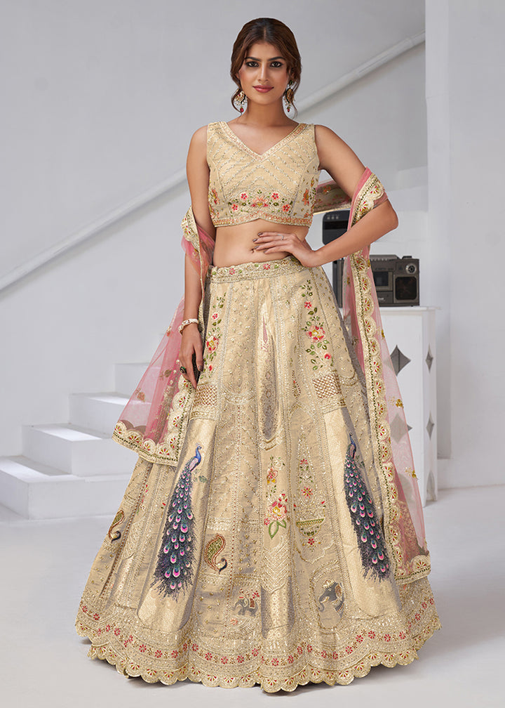 Buy Now Cream Peacock Feather Motifs Traditional Lehenga Choli Online in US, UK, Canada, France, Italy, Germany, Sweden, Denmark, Greece & Worldwide at Empress.