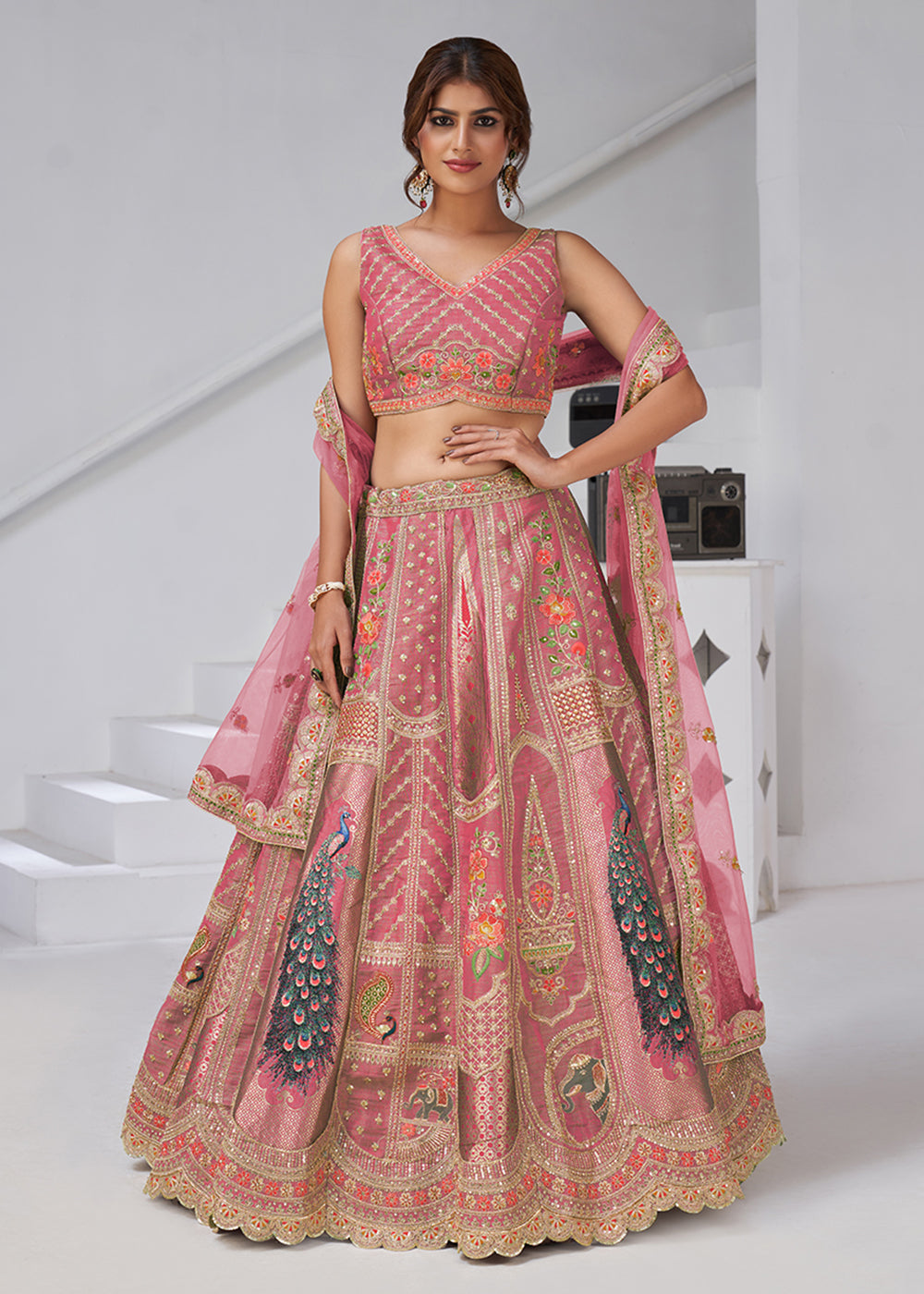 Buy Now Pink Peacock Feather Motifs Traditional Lehenga Choli Online in US, UK, Canada, France, Italy, Germany, Sweden, Denmark, Greece & Worldwide at Empress.