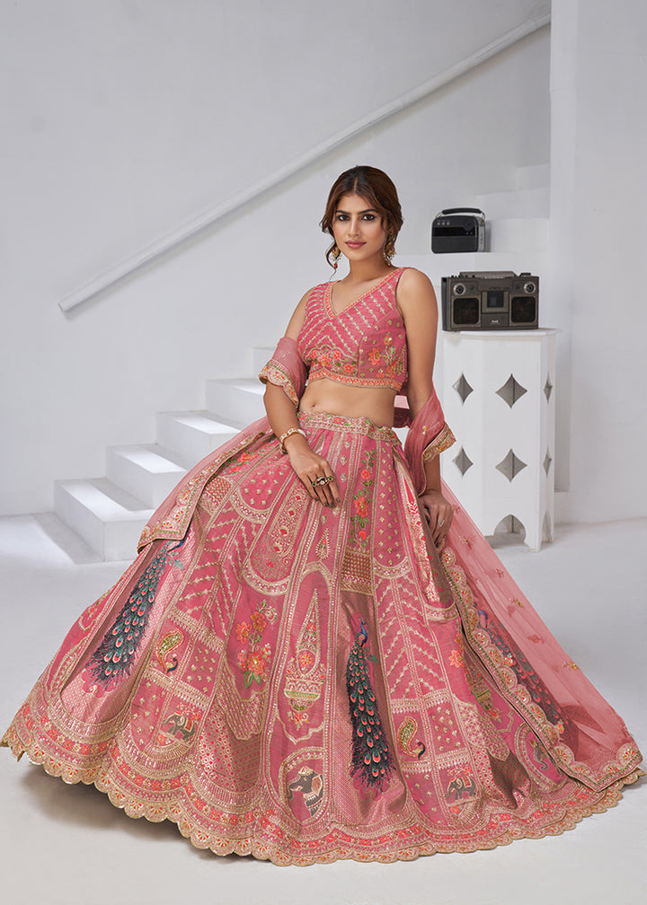 Buy Now Pink Peacock Feather Motifs Traditional Lehenga Choli Online in US, UK, Canada, France, Italy, Germany, Sweden, Denmark, Greece & Worldwide at Empress.