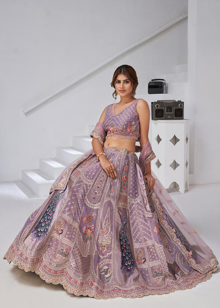 Buy Now Purple Peacock Feather Motifs Traditional Lehenga Choli Online in US, UK, Canada, France, Italy, Germany, Sweden, Denmark, Greece & Worldwide at Empress.