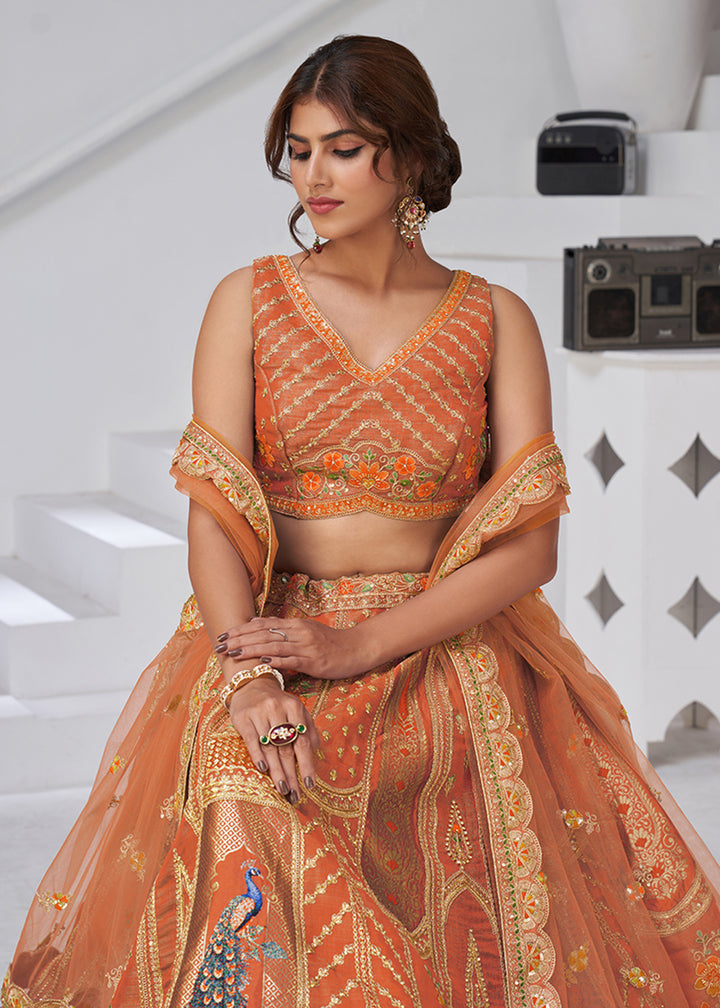 Buy Now Orange Peacock Feather Motifs Traditional Lehenga Choli Online in US, UK, Canada, France, Italy, Germany, Sweden, Denmark, Greece & Worldwide at Empress.