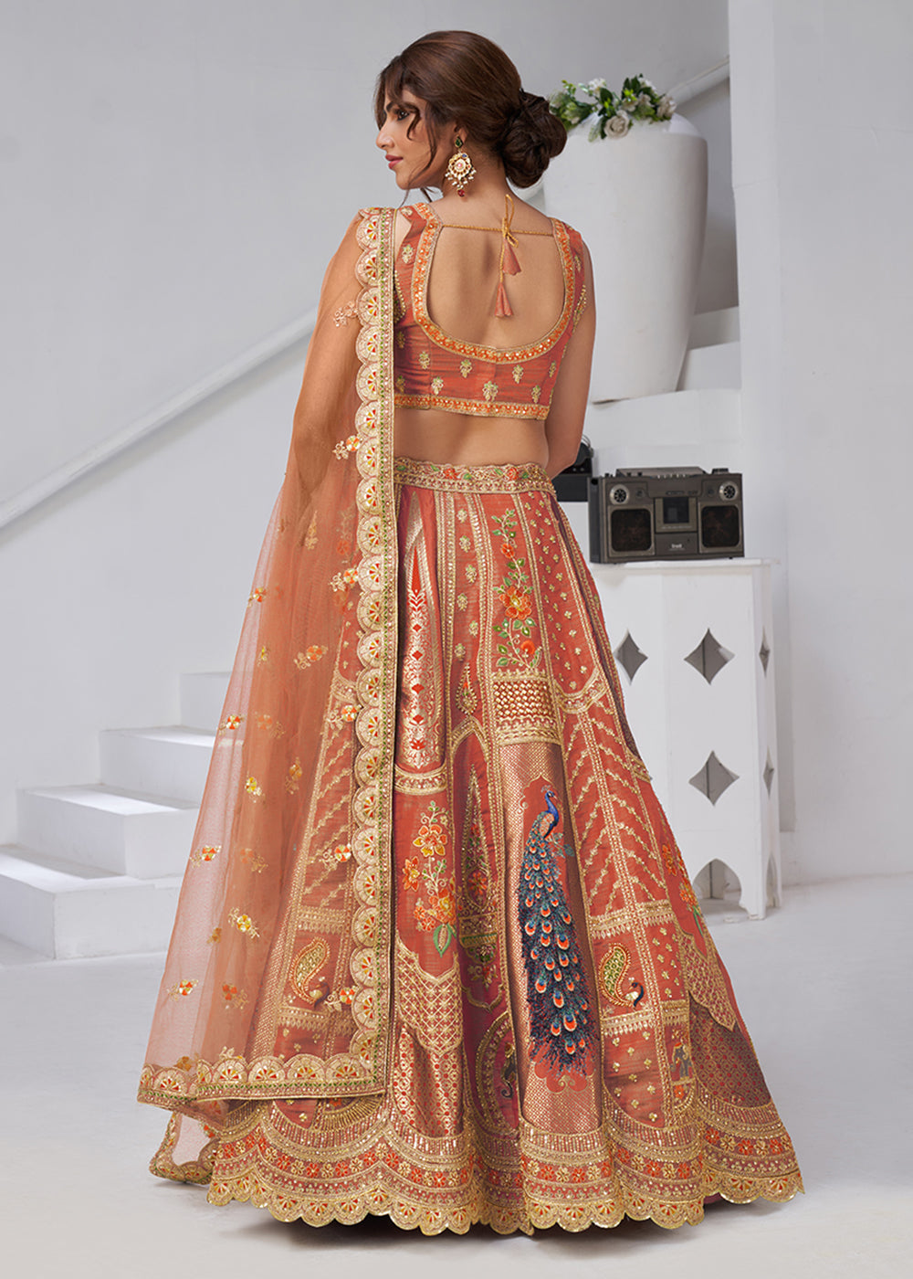 Buy Now Orange Peacock Feather Motifs Traditional Lehenga Choli Online in US, UK, Canada, France, Italy, Germany, Sweden, Denmark, Greece & Worldwide at Empress.