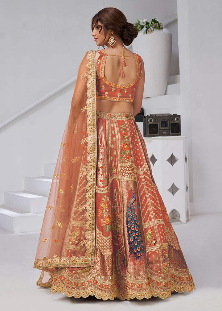 Buy Now Orange Peacock Feather Motifs Traditional Lehenga Choli Online in US, UK, Canada, France, Italy, Germany, Sweden, Denmark, Greece & Worldwide at Empress.