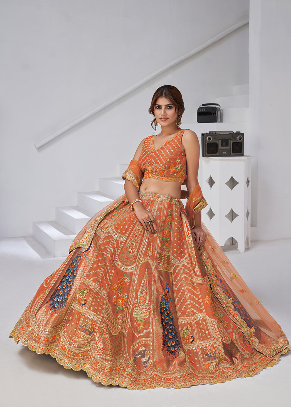 Buy Now Orange Peacock Feather Motifs Traditional Lehenga Choli Online in US, UK, Canada, France, Italy, Germany, Sweden, Denmark, Greece & Worldwide at Empress.
