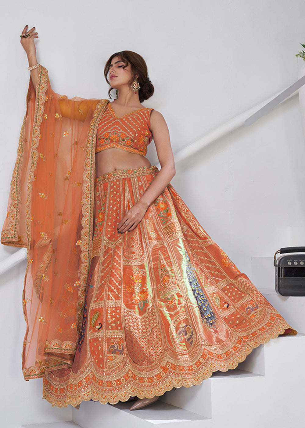 Buy Now Orange Peacock Feather Motifs Traditional Lehenga Choli Online in US, UK, Canada, France, Italy, Germany, Sweden, Denmark, Greece & Worldwide at Empress.
