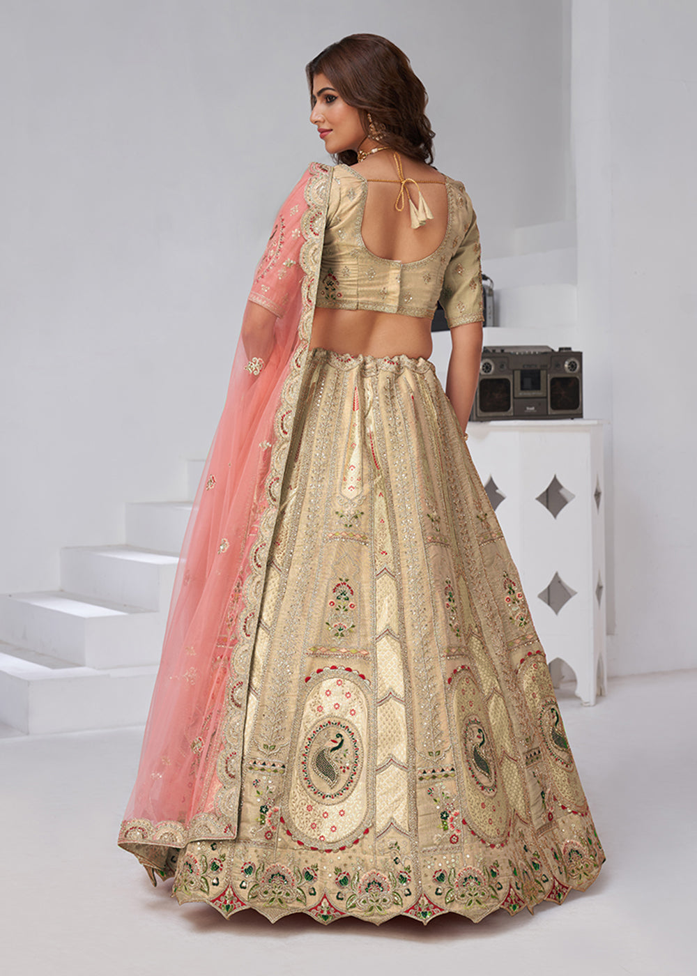 Buy Now Beige Peacock Paisley Motifs Traditional Lehenga Choli Online in US, UK, Canada, France, Italy, Germany, Sweden, Denmark, Greece & Worldwide at Empress.