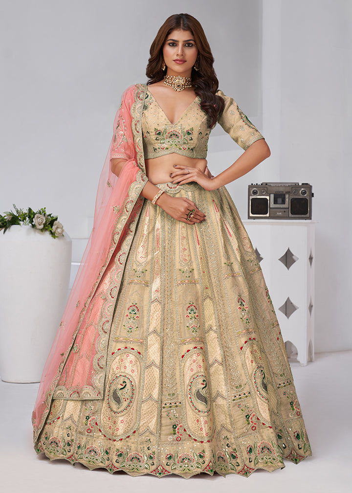 Buy Now Beige Peacock Paisley Motifs Traditional Lehenga Choli Online in US, UK, Canada, France, Italy, Germany, Sweden, Denmark, Greece & Worldwide at Empress.