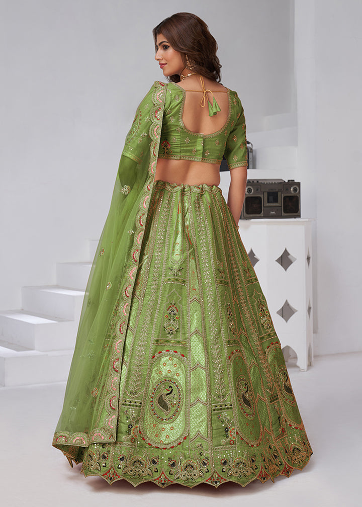Buy Now Green Peacock Paisley Motifs Traditional Lehenga Choli Online in US, UK, Canada, France, Italy, Germany, Sweden, Denmark, Greece & Worldwide at Empress.