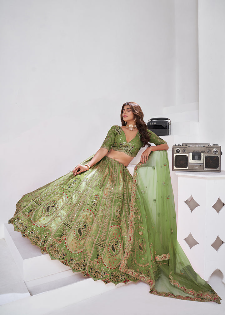 Buy Now Green Peacock Paisley Motifs Traditional Lehenga Choli Online in US, UK, Canada, France, Italy, Germany, Sweden, Denmark, Greece & Worldwide at Empress.