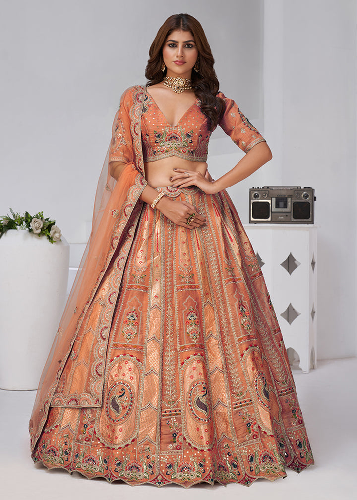 Buy Now Orange Peacock Paisley Motifs Traditional Lehenga Choli Online in US, UK, Canada, France, Italy, Germany, Sweden, Denmark, Greece & Worldwide at Empress