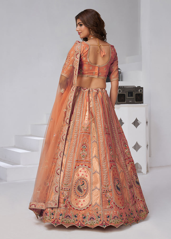 Buy Now Orange Peacock Paisley Motifs Traditional Lehenga Choli Online in US, UK, Canada, France, Italy, Germany, Sweden, Denmark, Greece & Worldwide at Empress