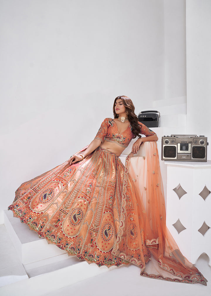 Buy Now Orange Peacock Paisley Motifs Traditional Lehenga Choli Online in US, UK, Canada, France, Italy, Germany, Sweden, Denmark, Greece & Worldwide at Empress