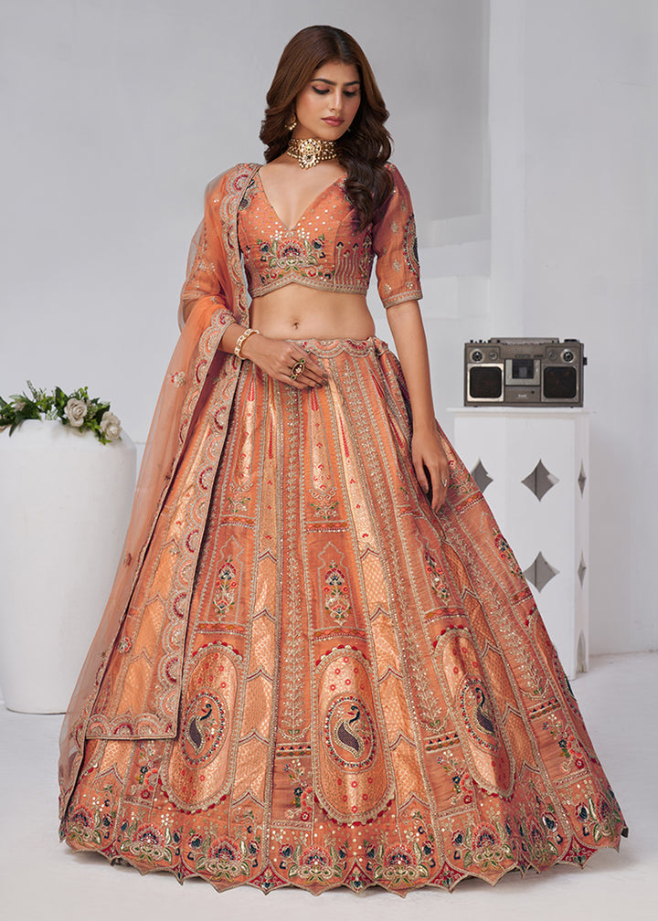 Buy Now Orange Peacock Paisley Motifs Traditional Lehenga Choli Online in US, UK, Canada, France, Italy, Germany, Sweden, Denmark, Greece & Worldwide at Empress