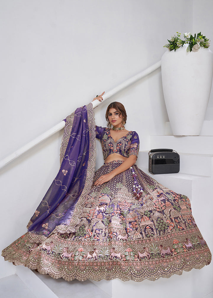 Buy Now Purple Temple & Cow Motifs Bridal Lehenga Choli Online in US, UK, Canada, France, Germany, Sweden, Denmark, Greece, Ireland & Worldwide at Empress.