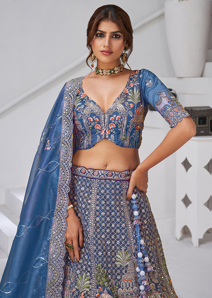Buy Now Teal Blue Temple & Cow Motifs Bridal Lehenga Choli Online in US, UK, Canada, France, Germany, Sweden, Denmark, Greece, Ireland & Worldwide at Empress.