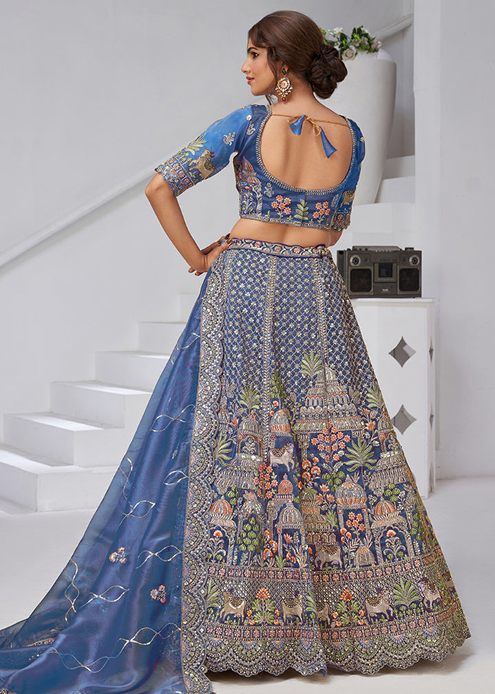 Buy Now Teal Blue Temple & Cow Motifs Bridal Lehenga Choli Online in US, UK, Canada, France, Germany, Sweden, Denmark, Greece, Ireland & Worldwide at Empress.