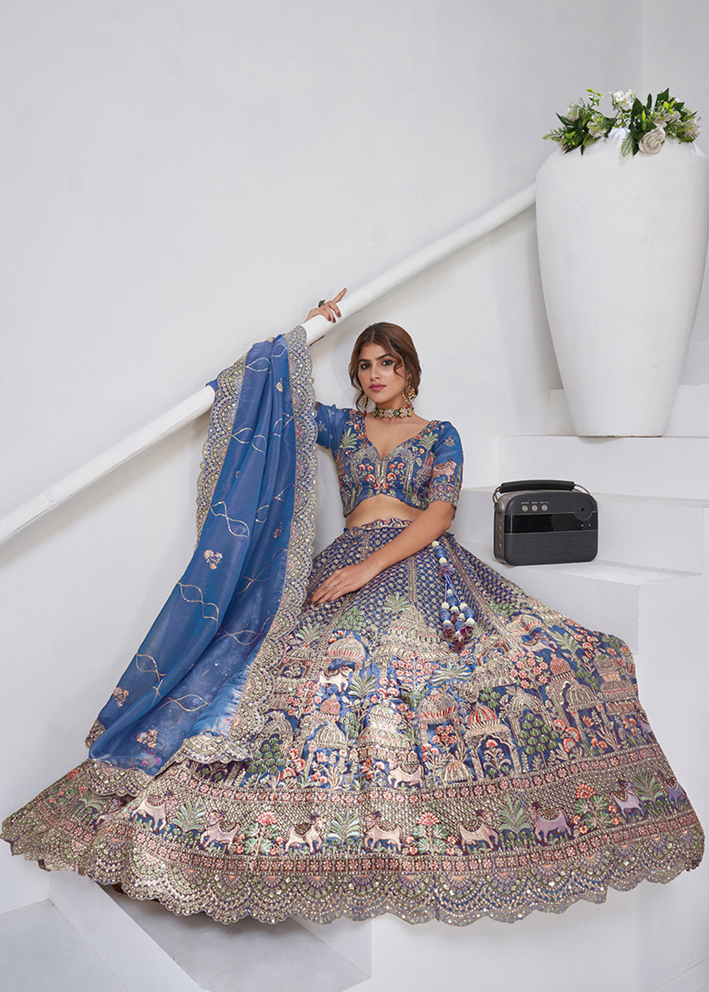 Buy Now Teal Blue Temple & Cow Motifs Bridal Lehenga Choli Online in US, UK, Canada, France, Germany, Sweden, Denmark, Greece, Ireland & Worldwide at Empress.