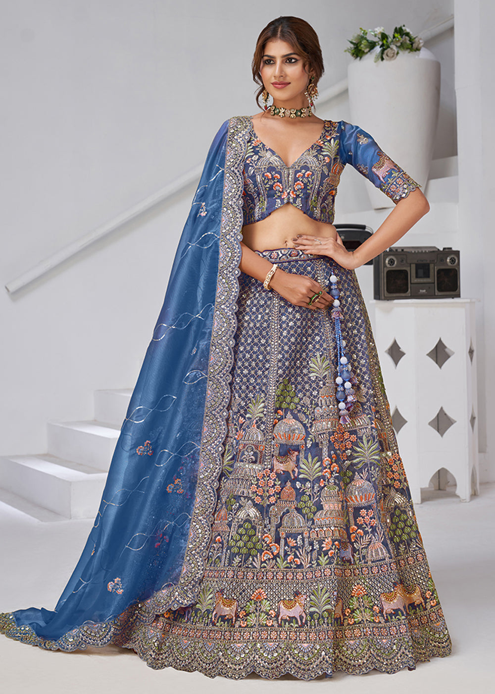 Buy Now Teal Blue Temple & Cow Motifs Bridal Lehenga Choli Online in US, UK, Canada, France, Germany, Sweden, Denmark, Greece, Ireland & Worldwide at Empress.