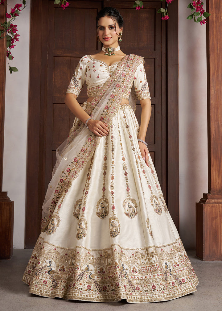 Buy Now Luxurious White Lehenga with Elegant Thread &amp; Peacock Design Online in US, UK, Canada, France, Italy, Greece, Sweden, Denmark &amp; Worldwide at Empress.