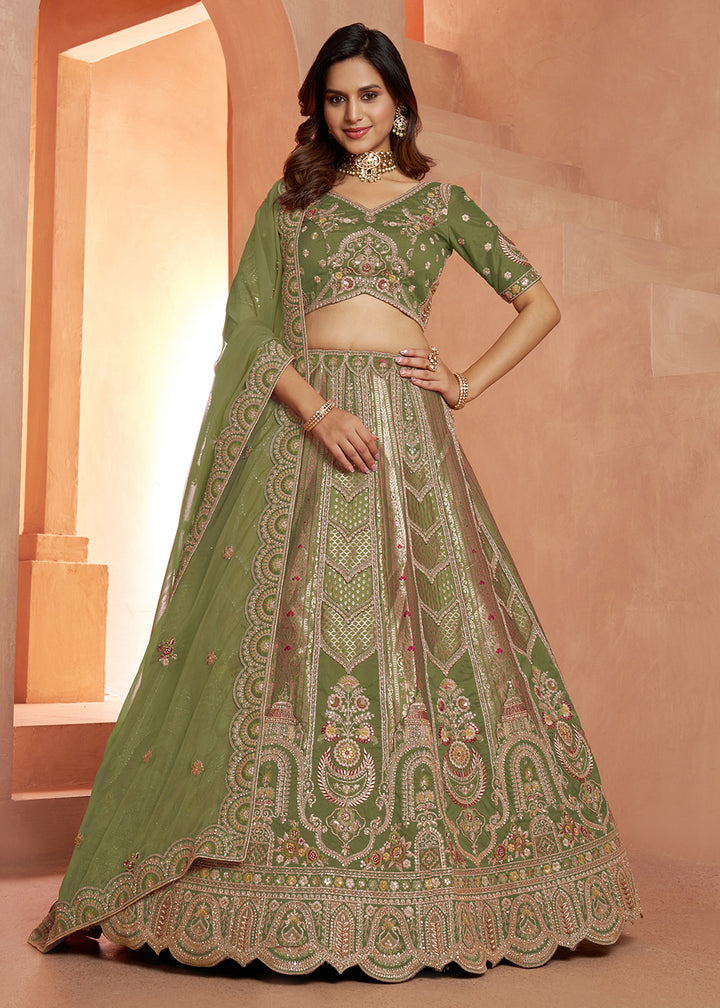 Buy Now Classic Green Silk Bridal Lehenga with Floral Zari Embroidery Online in US, UK, Canada, France, Italy, Greece, Sweden, Denmark &amp; Worldwide at Empress.