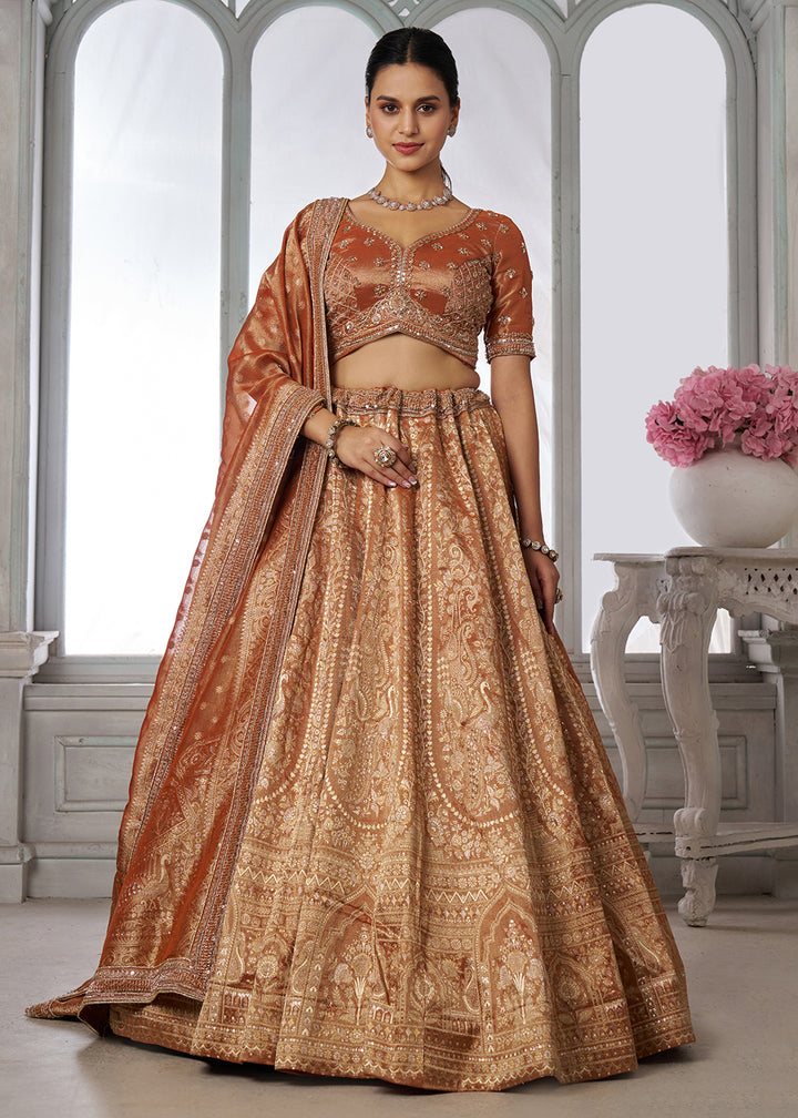 Buy Now Rust Zari Tissue Lehenga Adorned with Delicate Beadwork Online in US, UK, Canada, France, Italy, Greece, Sweden, UAE, Denmark &amp; Worldwide at Empress.