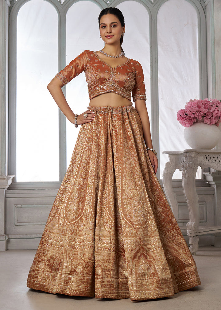 Buy Now Rust Zari Tissue Lehenga Adorned with Delicate Beadwork Online in US, UK, Canada, France, Italy, Greece, Sweden, UAE, Denmark &amp; Worldwide at Empress.
