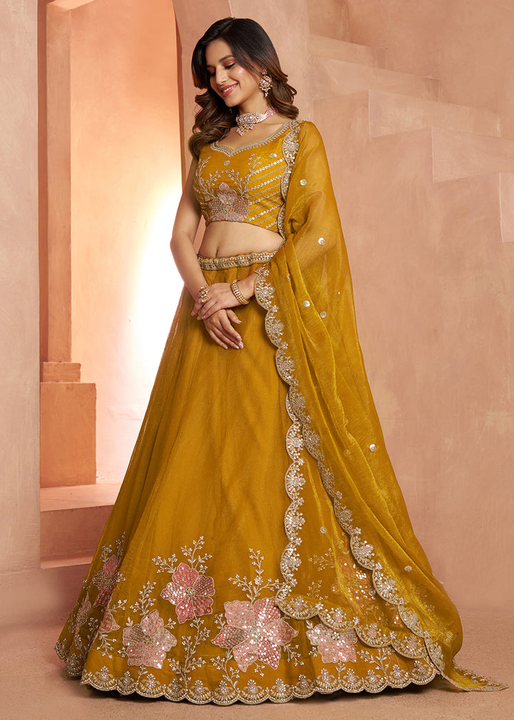 Buy Now Elegant Floral Mustard Embroidered Tissue Lehenga Choli Online in US, UK, Canada, France, Italy, Greece, Sweden, UAE, Denmark &amp; Worldwide at Empress.