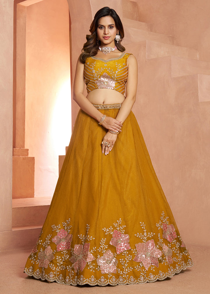 Buy Now Elegant Floral Mustard Embroidered Tissue Lehenga Choli Online in US, UK, Canada, France, Italy, Greece, Sweden, UAE, Denmark &amp; Worldwide at Empress.