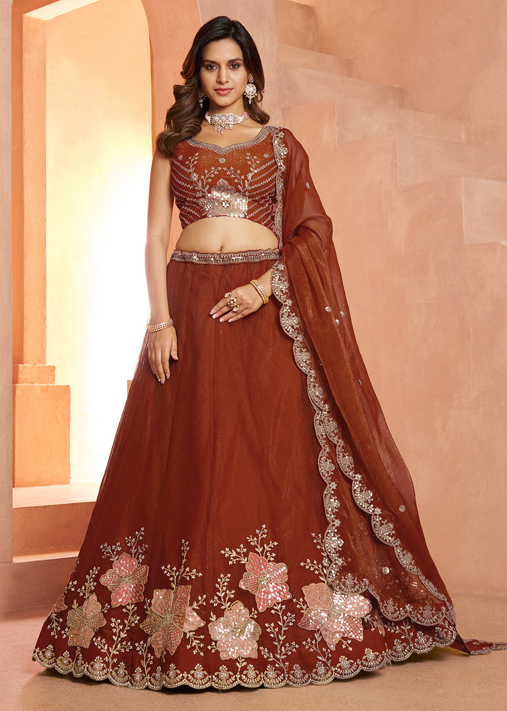 Buy Now Elegant Floral Rust Embroidered Tissue Lehenga Choli Online in US, UK, Canada, France, Italy, Greece, Sweden, UAE, Denmark & Worldwide at Empress.