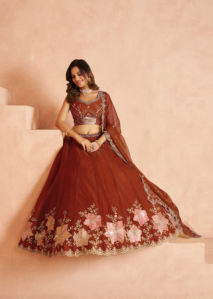 Buy Now Elegant Floral Rust Embroidered Tissue Lehenga Choli Online in US, UK, Canada, France, Italy, Greece, Sweden, UAE, Denmark &amp; Worldwide at Empress.