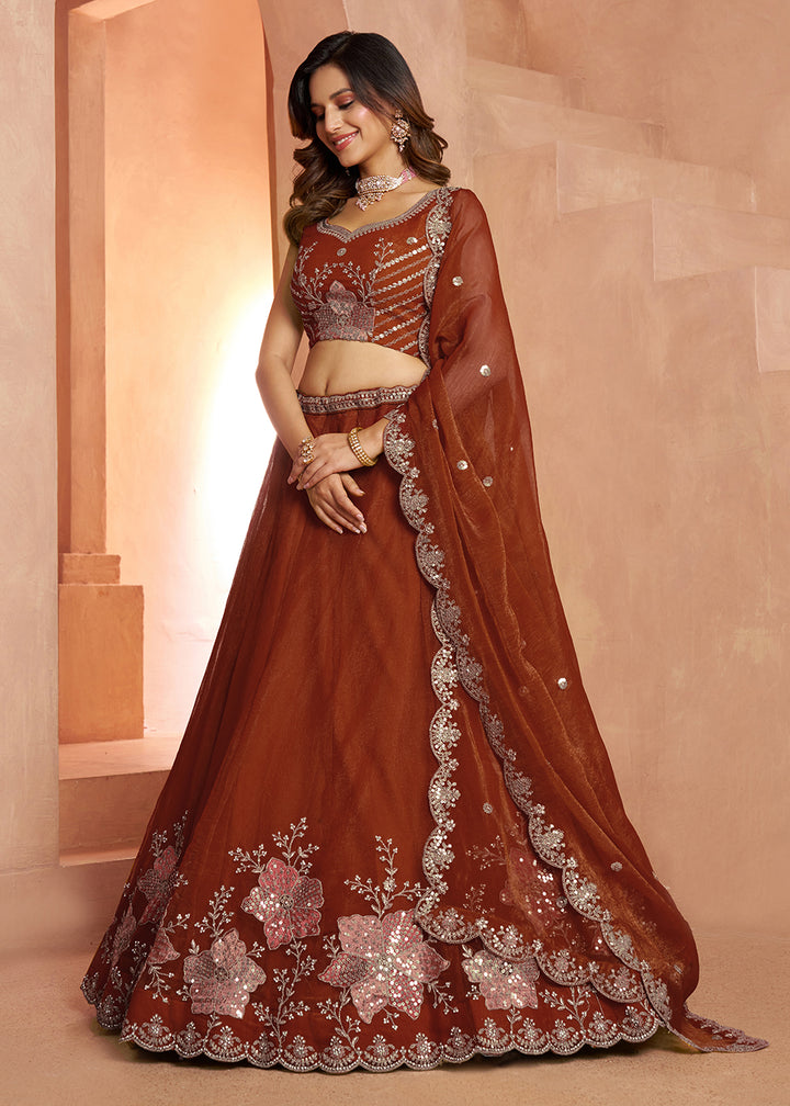 Buy Now Elegant Floral Rust Embroidered Tissue Lehenga Choli Online in US, UK, Canada, France, Italy, Greece, Sweden, UAE, Denmark &amp; Worldwide at Empress.