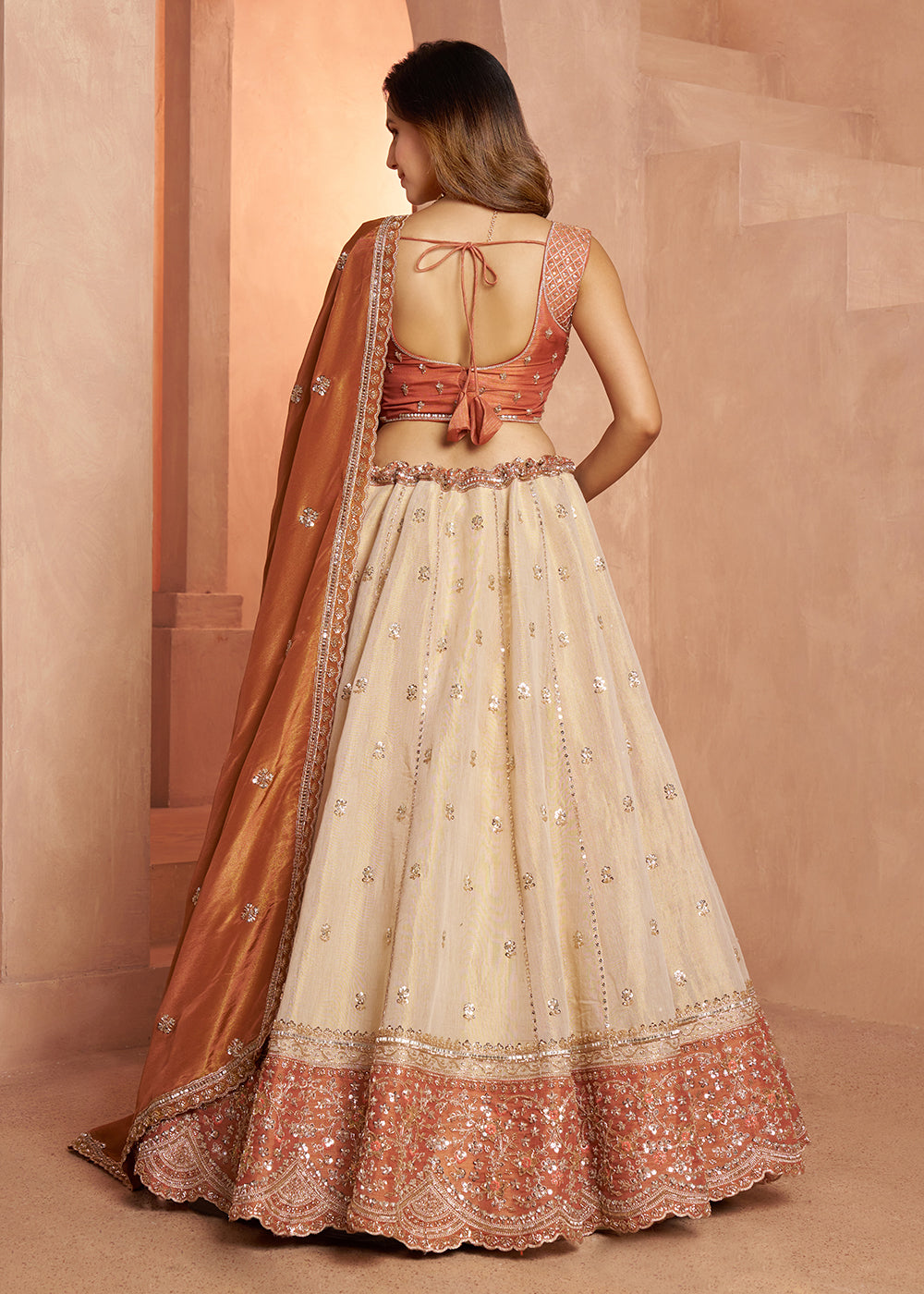 Buy Now Designer Rust Lehenga with Luxurious Embellished Details Online in US, UK, Canada, France, Italy, Greece, Sweden, UAE, Denmark &amp; Worldwide at Empress.