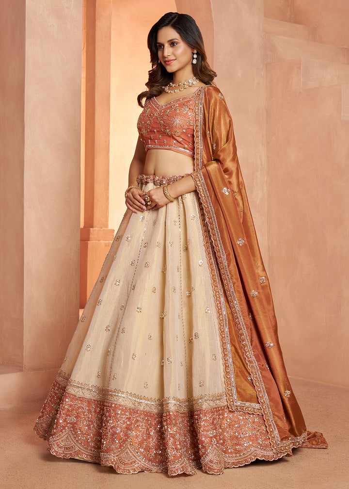 Buy Now Designer Rust Lehenga with Luxurious Embellished Details Online in US, UK, Canada, France, Italy, Greece, Sweden, UAE, Denmark &amp; Worldwide at Empress.